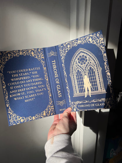 Throne of Glass bookish gift rebind on dark blue book cloth and gold vinyl detailing